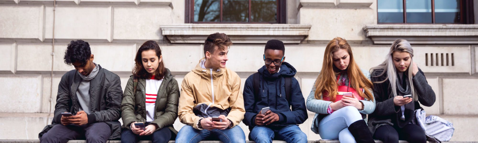 Gang Of Teenagers Hanging Out on Mobile Devices